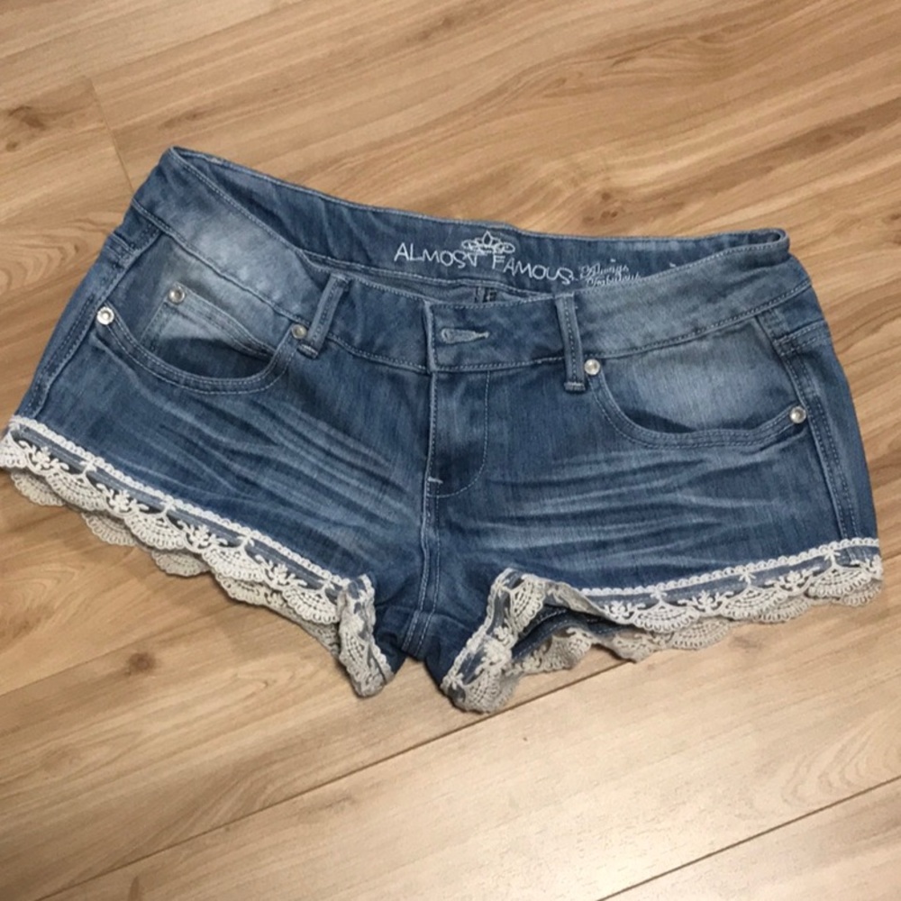 Almost Famous lace trimmed legs denim short-shorts.